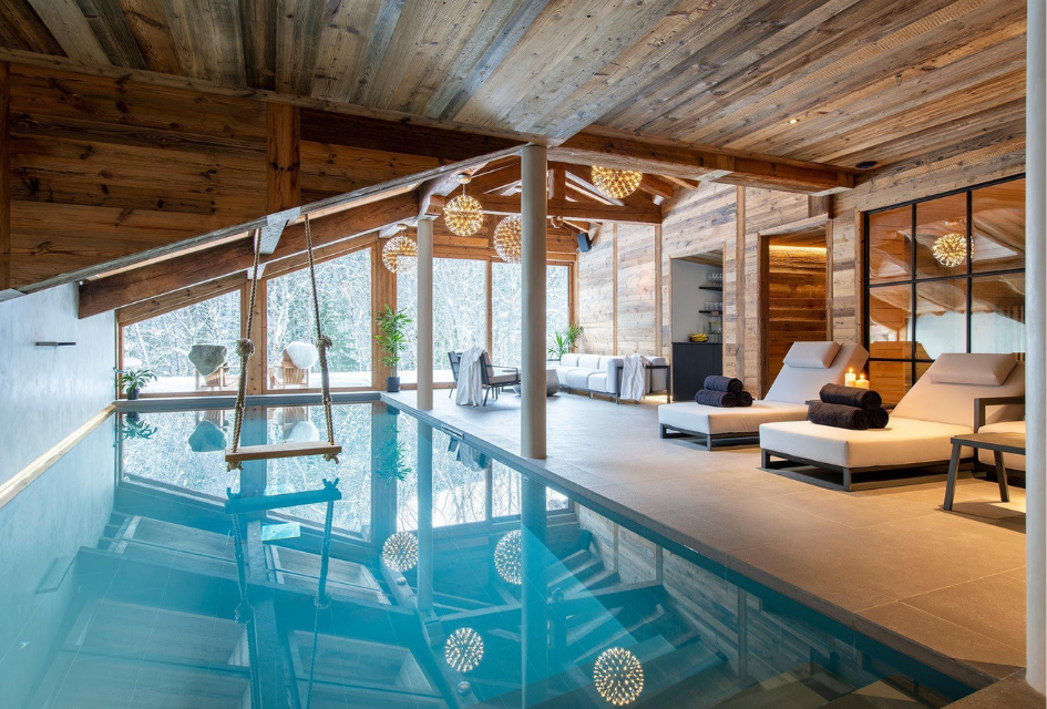 Pool with a swing inside Chalet Tataali, one of the best luxury family ski holidays in Morzine for a celebration holiday
