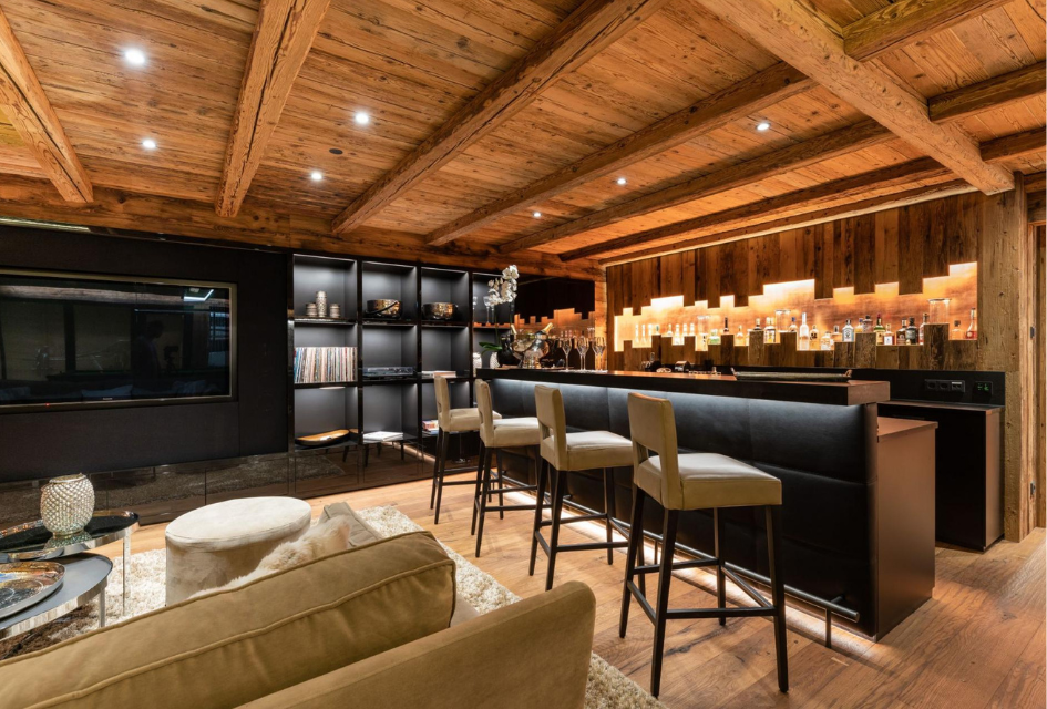 Celebrate in the stylish bar area on your party ski holiday for a special occasion at Chalet ÜberHaus in Lech.
