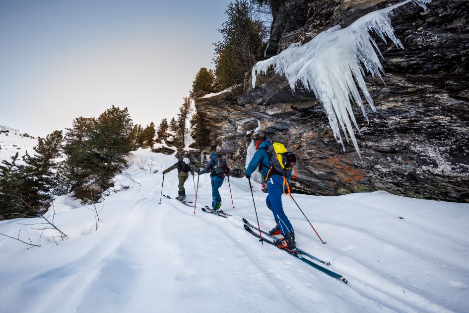 Ski touring past frozen waterfalls, an incredible ski experience. 