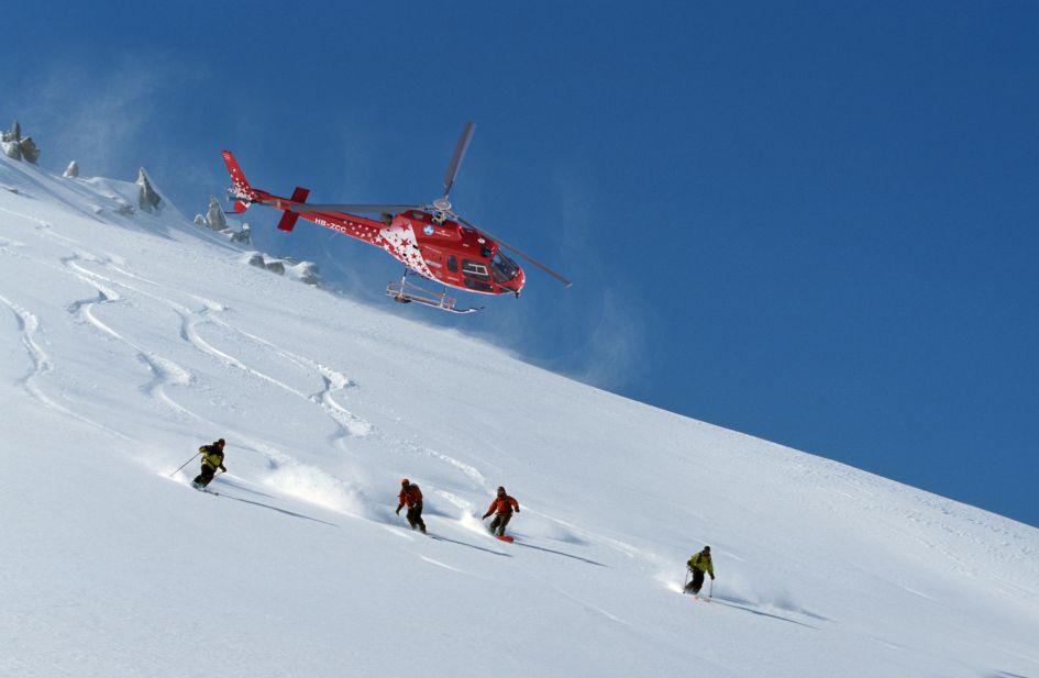 Heliskiing through untoched powder, one of the best ultimate luxury ski experiences.