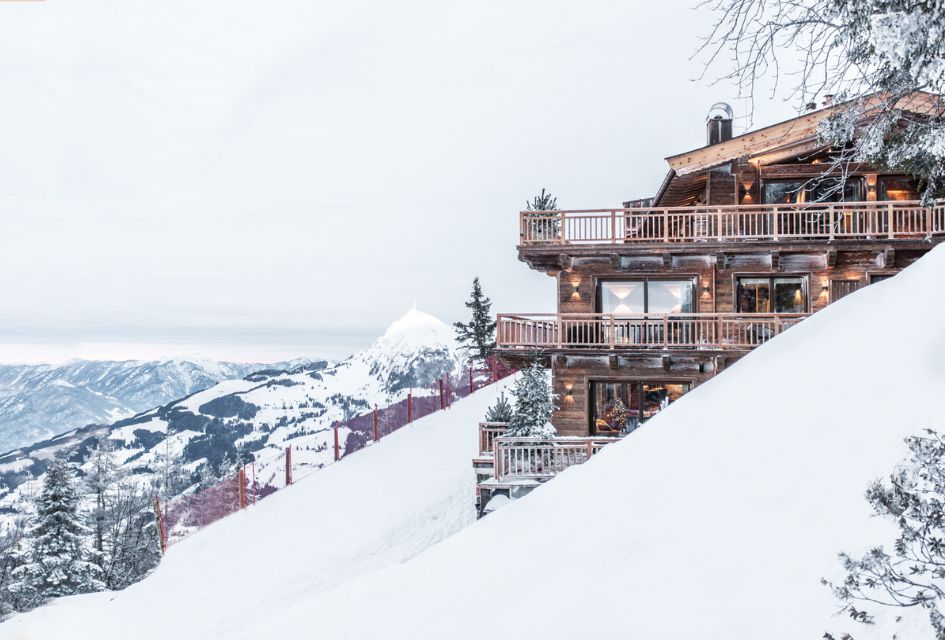 Exterior of Hahnenkamm Lodge in Kitzbühel, showcasing the ski-in, ski-out access of this chalet, one of the best in Austria.